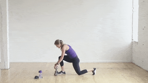 woman performing a low lunge and rear leg lift in a leg workout