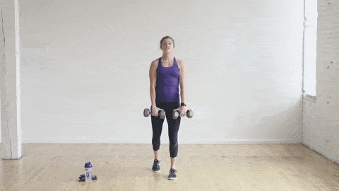 woman performing a staggered deadlift with dumbbells as part of the best leg exercises for women