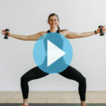 woman performing cardio barre exercises in a barre blend workout