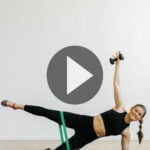 woman performing cardio barre exercises in a barre blend workout