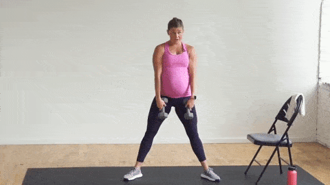 pregnant woman performing a sumo squat and deadlift in a strength workout that is safe for pregnancy