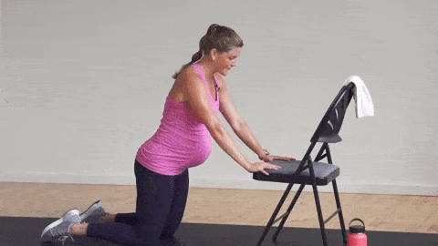 pregnant woman performing incline push ups and shoulder taps as part of pregnancy safe core exercises
