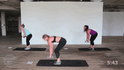 three women performing a burpee and dumbbell back row in a total body strength and HIIT workout
