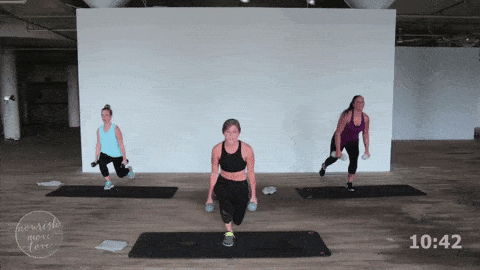 three women performing a reverse lunge and bicep curl in a 20 minute hiit workout