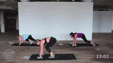 three women performing a plank jack and tuck plank exercise