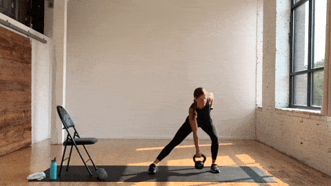 woman performing a single leg deadlift and lateral lunge with a kettlebell