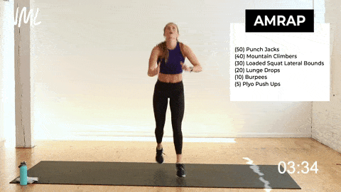 woman performing lunge jumps in a cardio workout at home