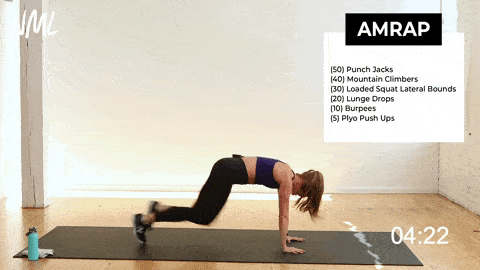 woman performing mountain climbers  in a fat burning workout 