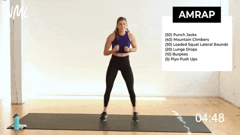 woman performing punch jacks in a high intensity cardio workout