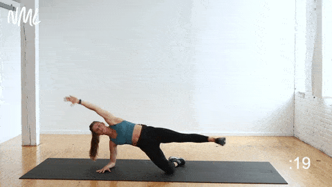 woman performing a side plank toe touch for the obliques in an intense ab workout 