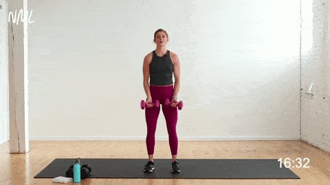 Women performing alternating shoulder raises or Lateral Raises with dumbbells 