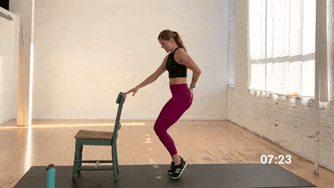 woman performing tippy toe squats in an abs, butt and thighs workout