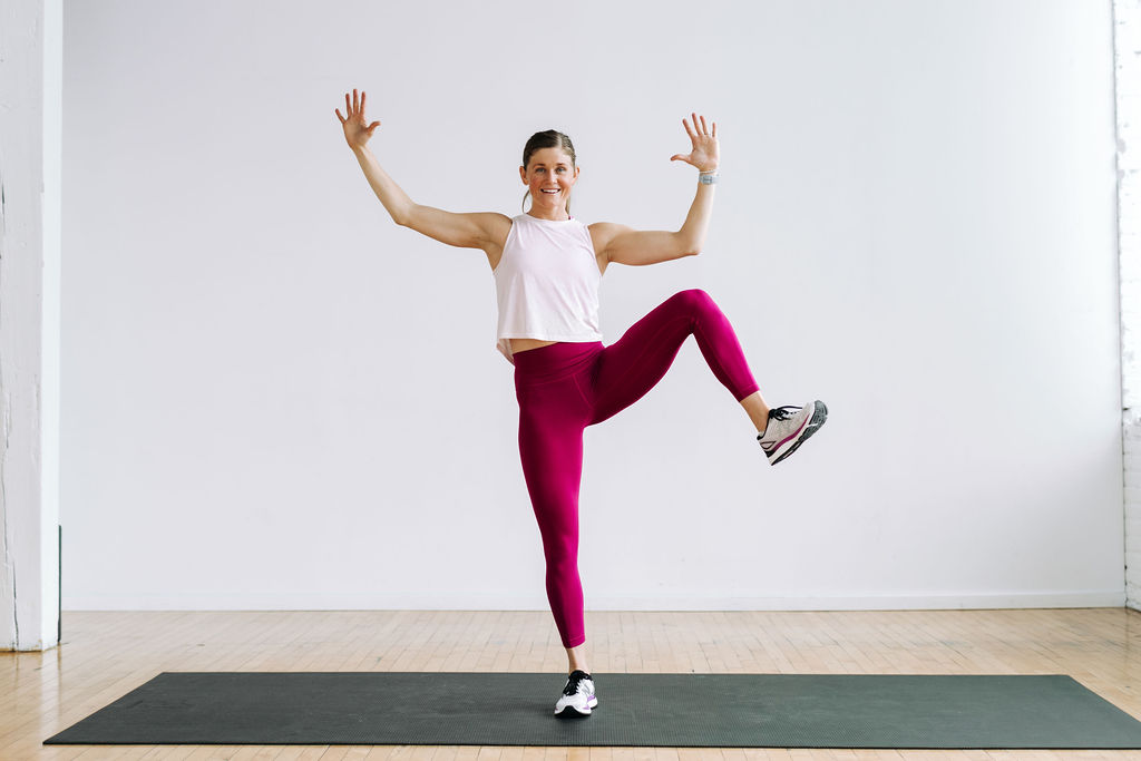 woman performing a sumo knee drive in a cardio workout for beginners