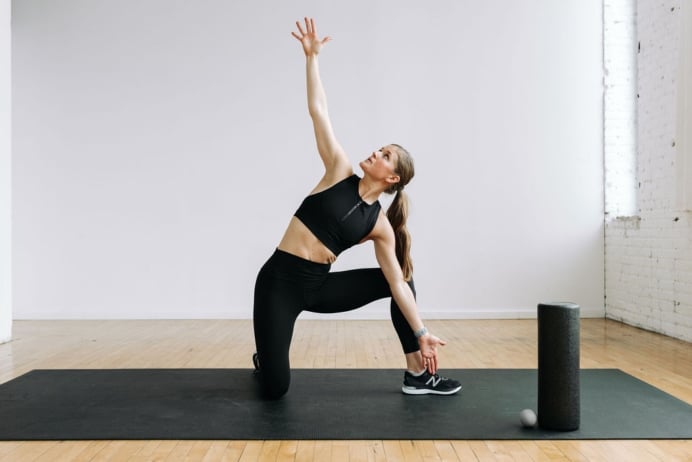 Woman performing Hip Opening Stretches Morning Stretch Routine