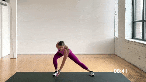 woman performing rapid lateral squats in a dynamic warm up