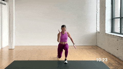 woman performing a step tow touch and step back lunge in a dynamic warm up