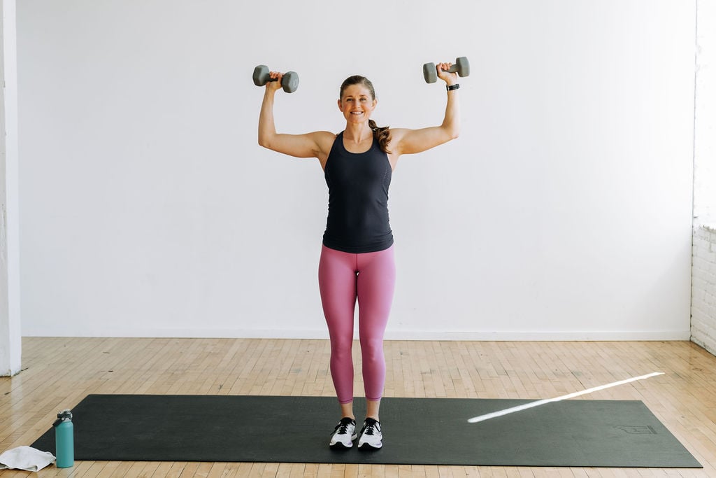 5 best upper body exercises for women | woman performing Arnold press