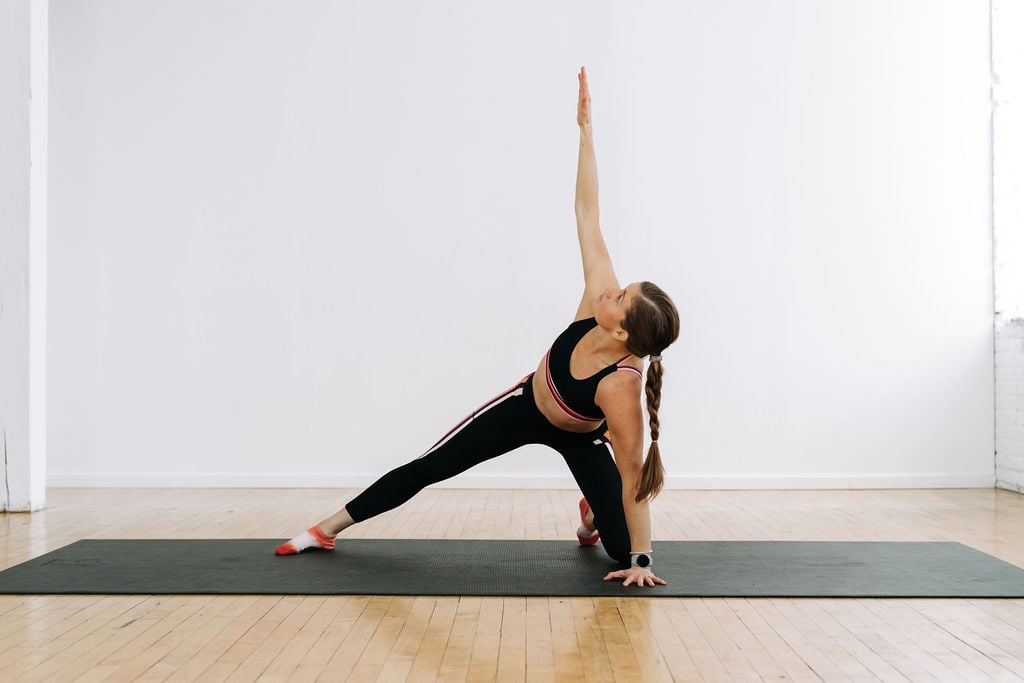 woman performing a t-spine stretch as part of an upper body stretch routine