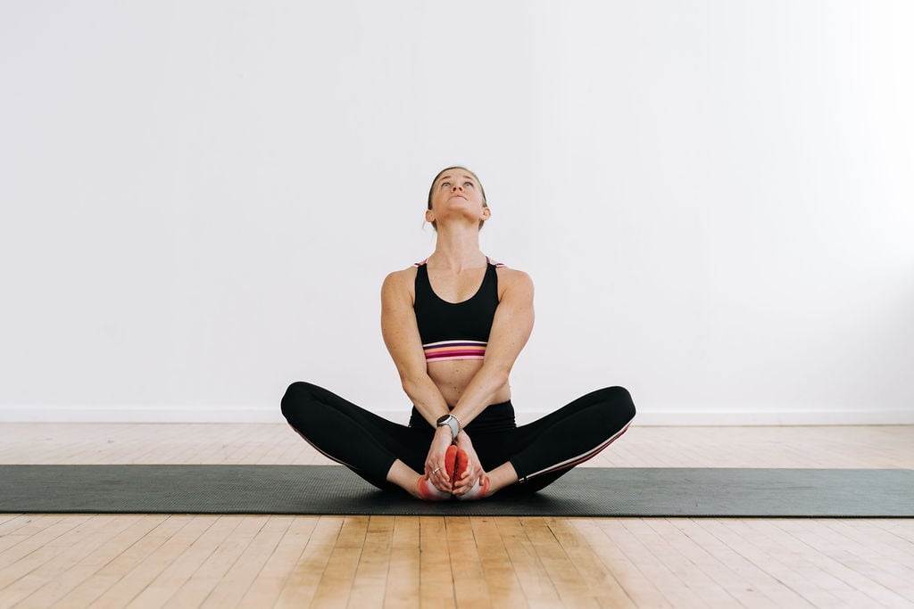 woman performing a neck stretch in an upper body stretch routine