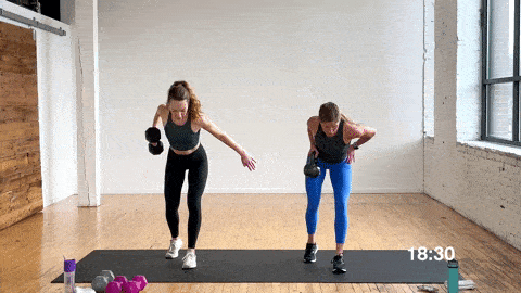 two women performing a single arm back row and kettlebell high pull in a full body workout