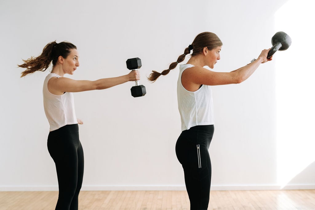 two women performing kettlebell swings in a kettlebell workout for women
