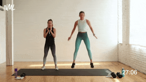 two women performing a goblet squat jump as part of explosive exercises for legs