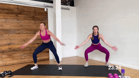 two women performing plyo squat jacks or plyo sumo squats in the best HIIT exercises for women at home