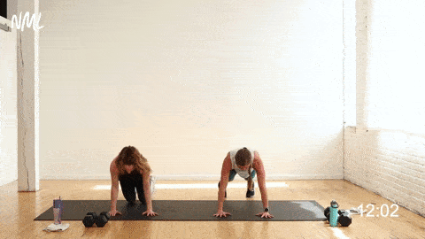 two women performing a push up and mountain climbers in an explosive workout