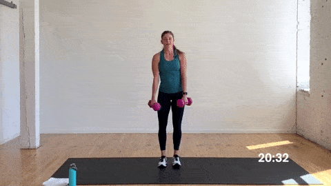 woman performing alternating lateral lunges with dumbbells in a superset workout