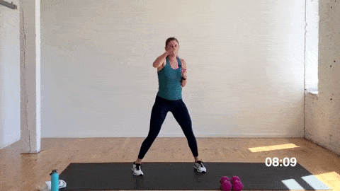 woman performing punch jacks in a superset workout