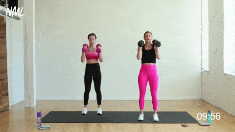two women performing a hinge swing and narrow squat in a strength and conditioning workout