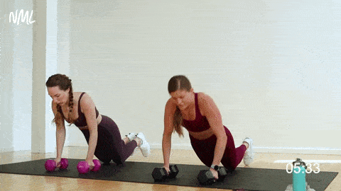 two women performing push ups in a 15 minute strength workout