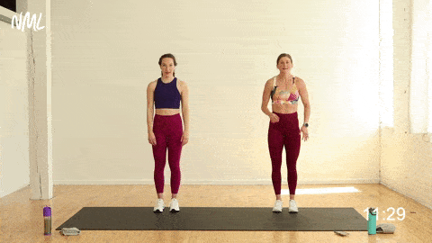 two women performing a 3-way lunge and knee drive in a low impact cardio workout at home