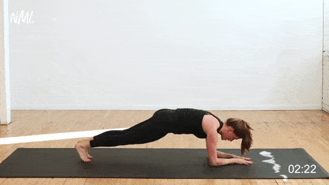 woman performing a low plank pike walk in as part of the best lower ab exercises
