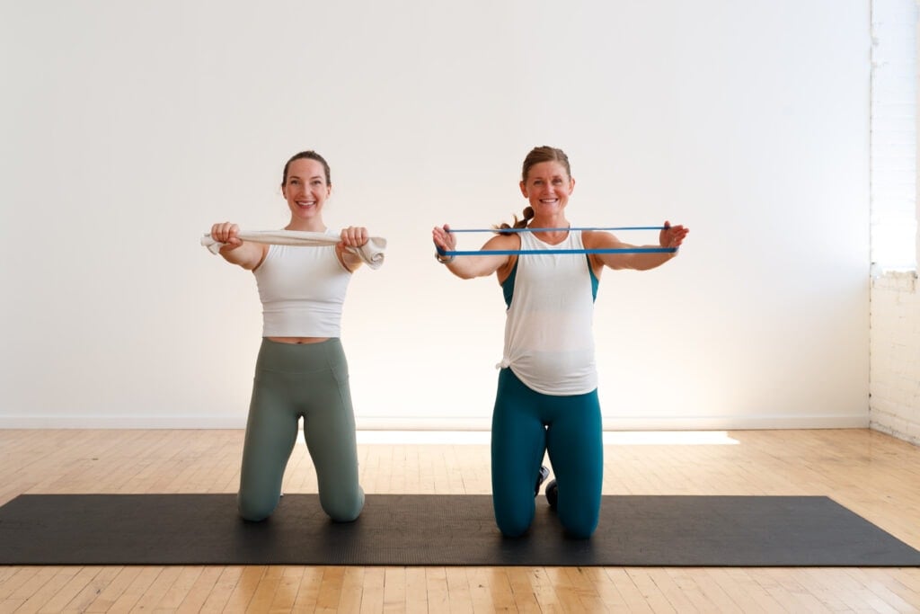 two women performing a hip lift and resistance band pull as part of first trimester ab exercises