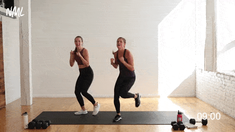 two women performing an elbow block and jab as part of cardio drills at home