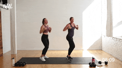 two women performing a jab, hook, upper cut and speed bag combo in a strength and cardio kickboxing workout at home