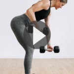Pin for Pinterest back workout for women - shows woman performing a back row