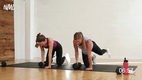 two women performing a bird dog row as a first trimester exercise