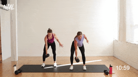 two women performing a single arm row and snatch in a prenatal workout first trimester