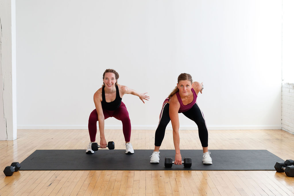 two women performing part of a Dumbbell Snatch | part of Leg Day Exercises At Home With Weights