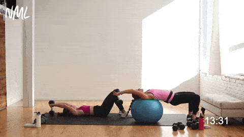 two women performing a dumbbell pullover as part of dumbbell back exercises