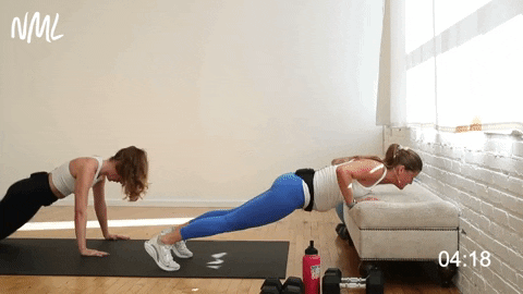 two women performing a push up and wide knee drive from bench or ground in an upper body workout