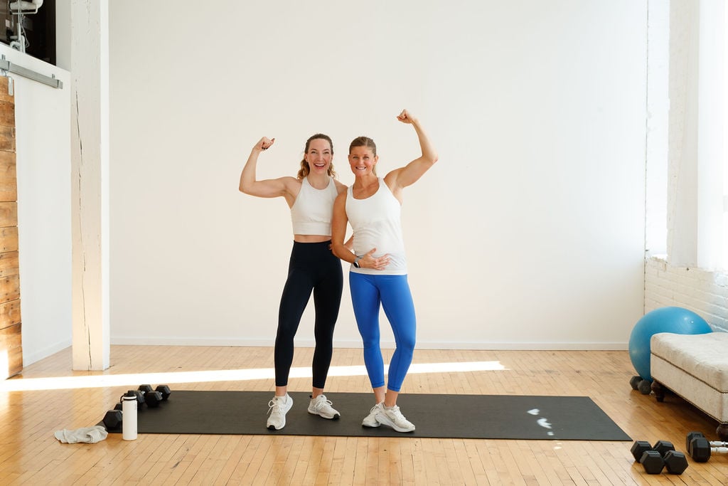chest and arm workout cover image | two women standing together flexing their arm muscles