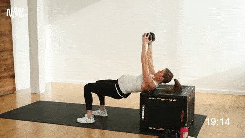 pregnant woman performing a hip thrust and dumbbell chest press from a bench
