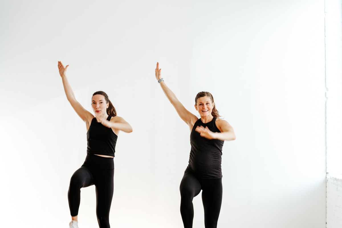 two women performing low impact cardio exercises for weight loss