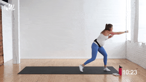 pregnant woman performing 2 lateral walks and 1 cross jab, prenatal workout at home