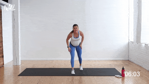 pregnant woman performing 3 knee drives and 3 lunge pulses, bodyweight cardio workout