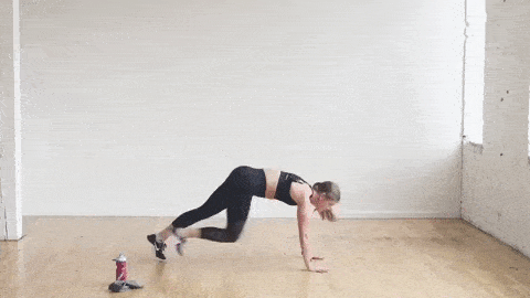 How to do mountain climbers, woman performing mountain climbers from a high plank position. HIIT cardio workout at home. 