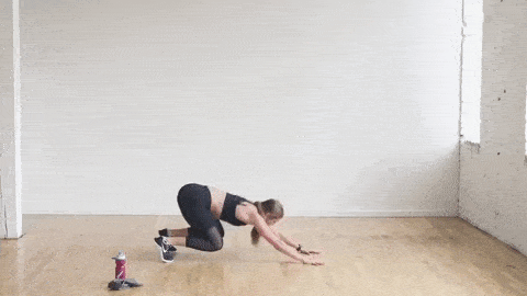 woman performing plank launcher push ups
